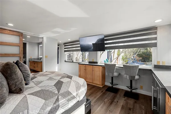 a living room with furniture and kitchen view