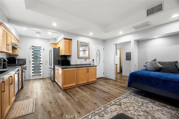 a kitchen with stainless steel appliances a stove and a refrigerator