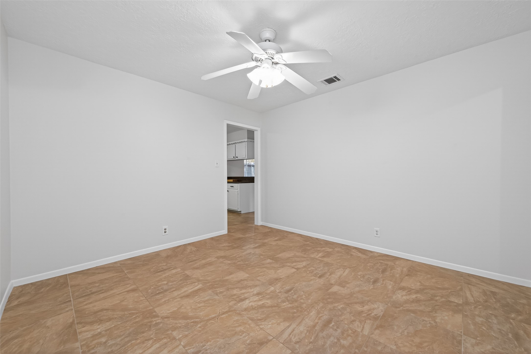 23919 Farm Hill Drive Spring, TX 77373 - Photo 24 of 41 an empty room with a chandelier fan and windows