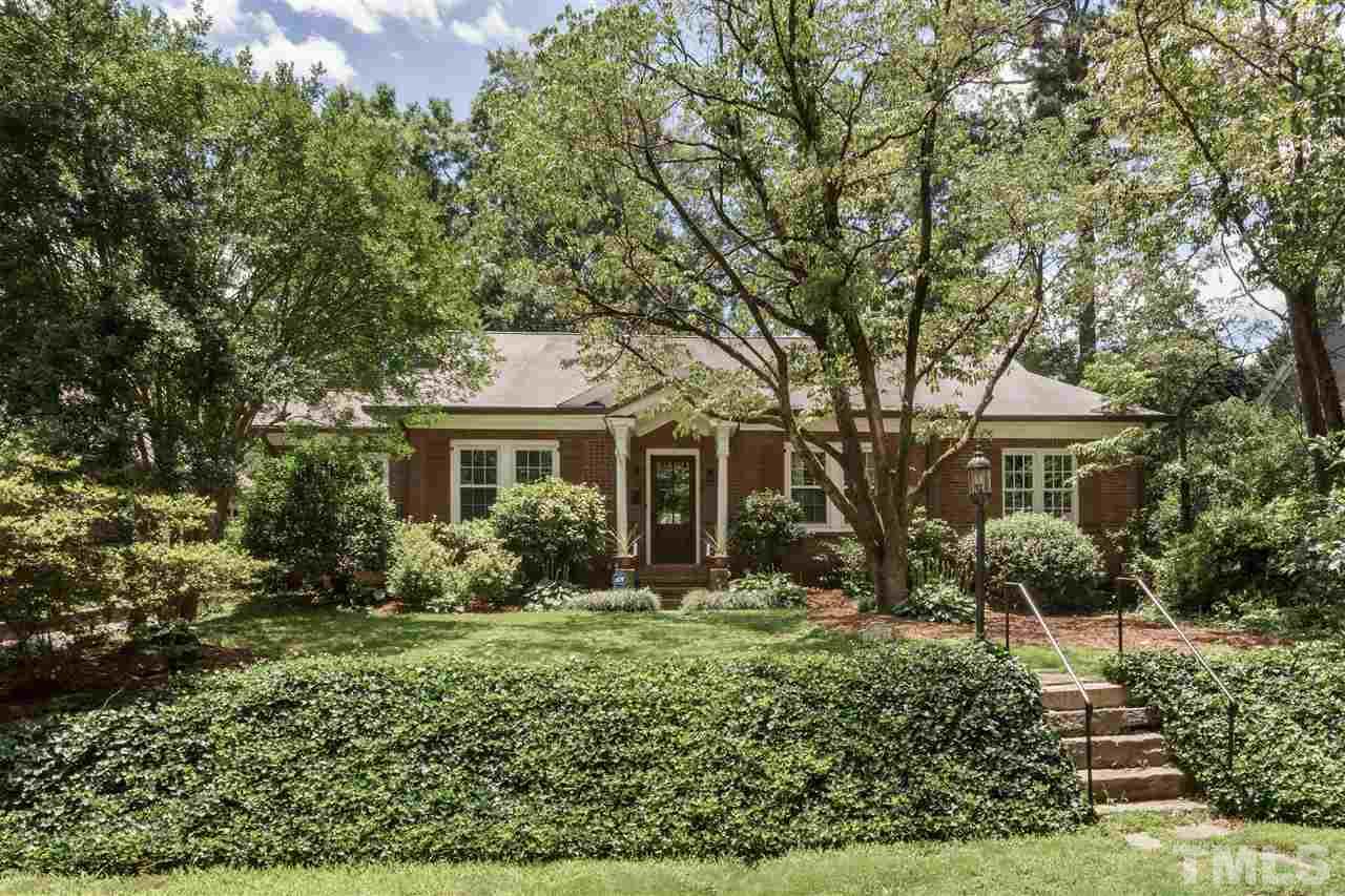 2237 The Circle Raleigh, NC 27608 - Photo 1 of 22 a front view of a house with a yard