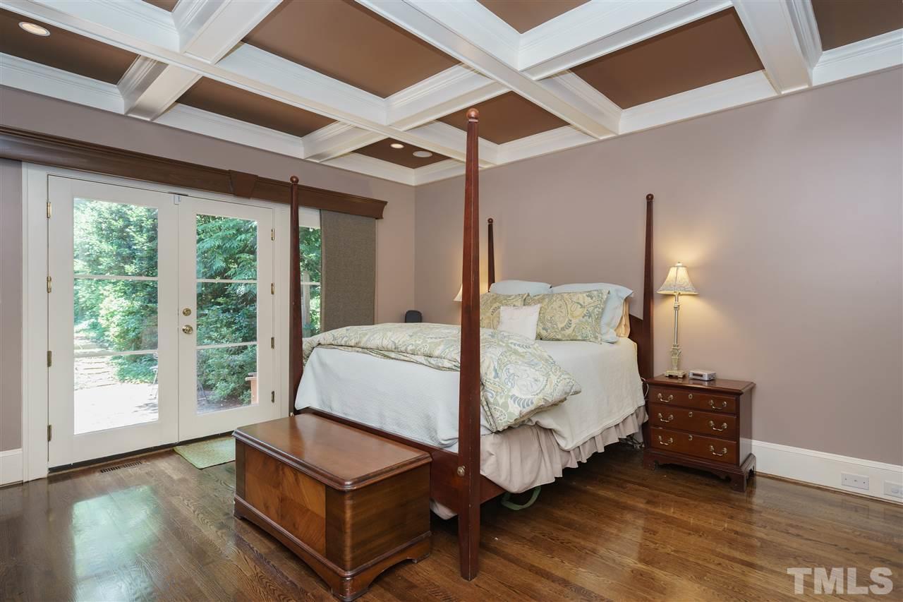 2237 The Circle Raleigh, NC 27608 - Photo 11 of 22 a bed room with a bed and a chair