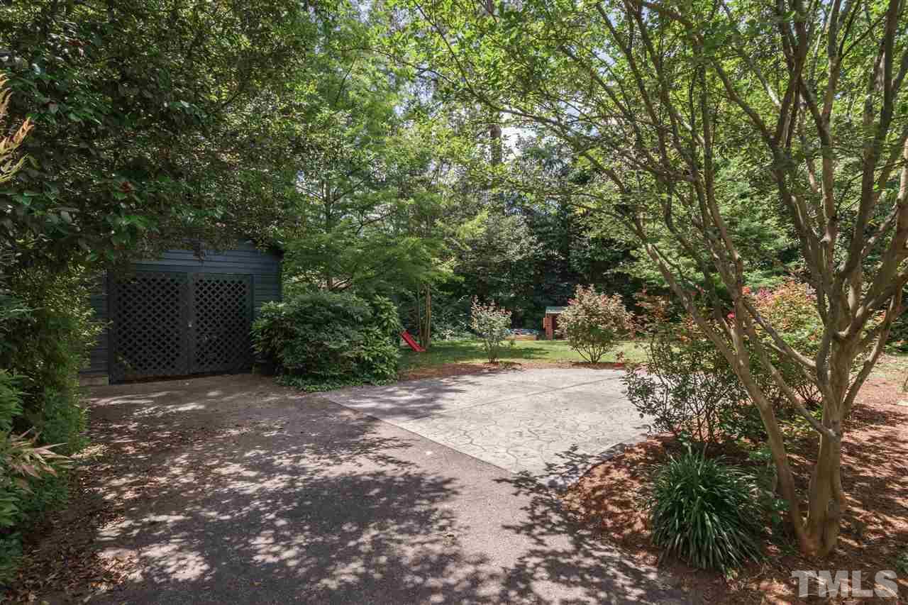 2237 The Circle Raleigh, NC 27608 - Photo 22 of 22 a view of a yard with plants and trees