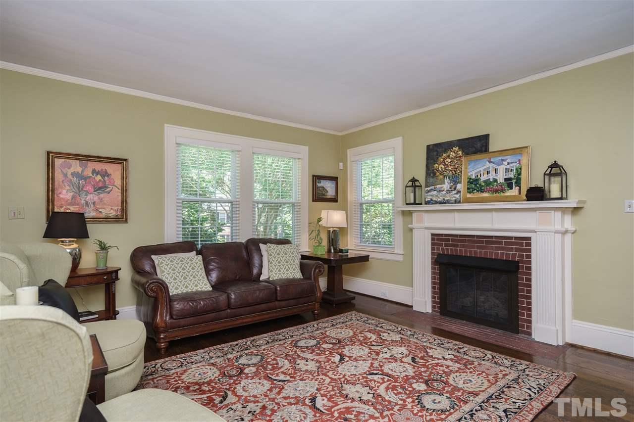 2237 The Circle Raleigh, NC 27608 - Photo 4 of 22 a living room with furniture and a fireplace