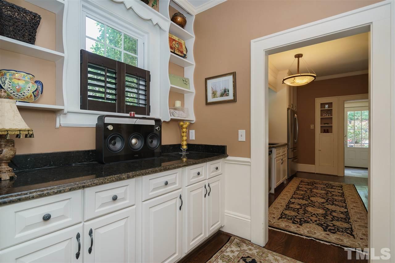 2237 The Circle Raleigh, NC 27608 - Photo 9 of 22 a kitchen with stainless steel appliances a stove a microwave and cabinets
