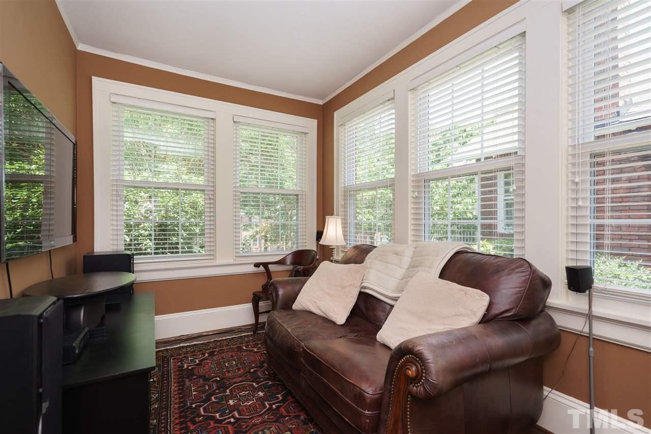 2237 The Circle Raleigh, NC 27608 - Photo 10 of 22 a living room with furniture and a large window