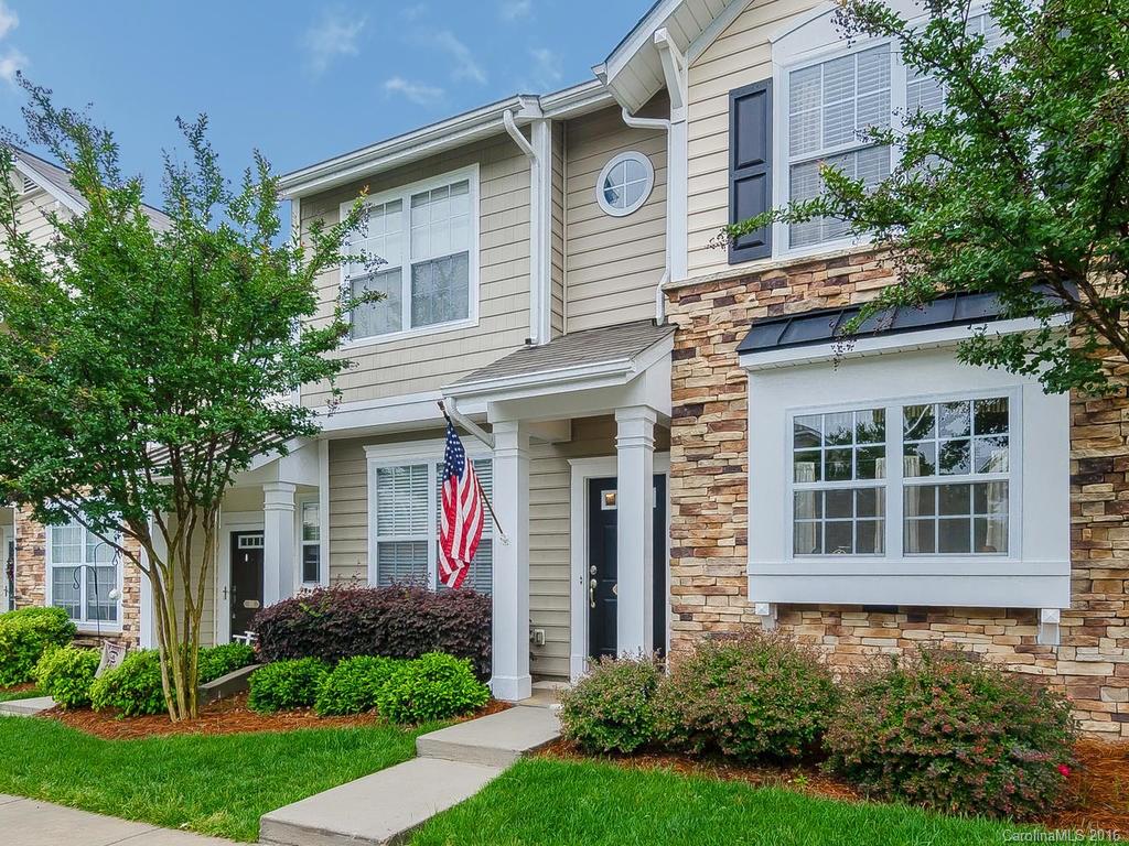 108 Chimney Rock Lane, Unit 16 Fort Mill, SC 29708 - Photo 1 of 21 a front view of a house with garden and porch