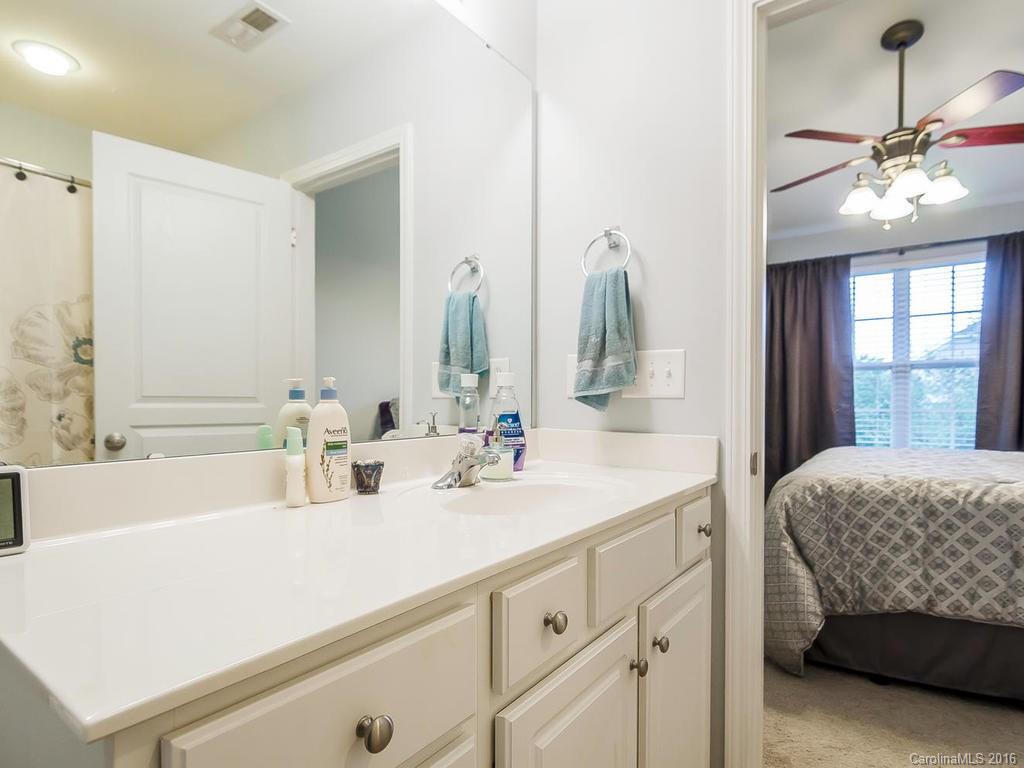 108 Chimney Rock Lane, Unit 16 Fort Mill, SC 29708 - Photo 12 of 21 a en suite bathroom with a double vanity sink and mirror