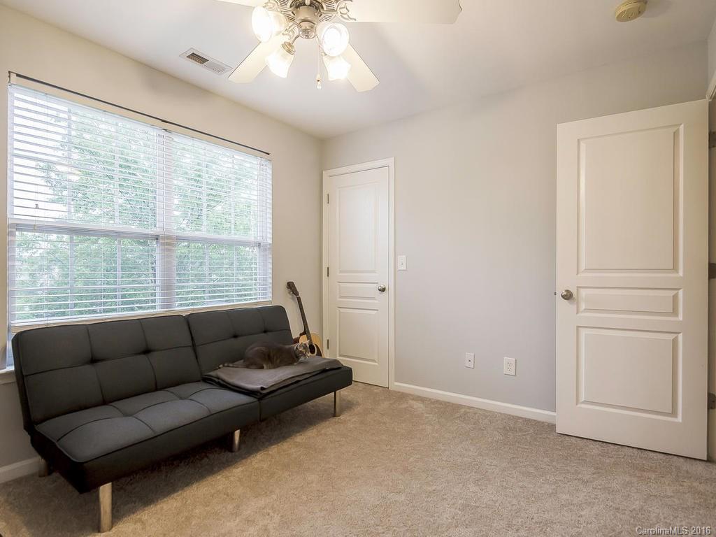 108 Chimney Rock Lane, Unit 16 Fort Mill, SC 29708 - Photo 14 of 21 a living room with furniture and a window
