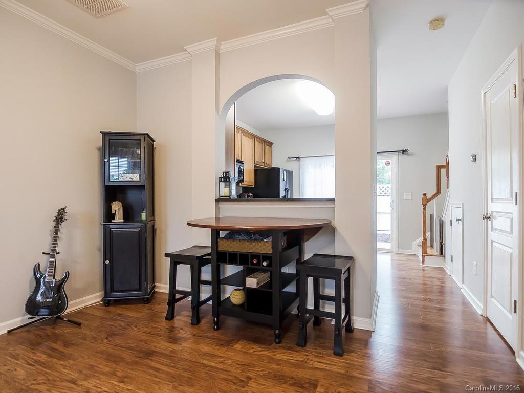 108 Chimney Rock Lane, Unit 16 Fort Mill, SC 29708 - Photo 6 of 21 a view of a dining room with furniture and wooden floor