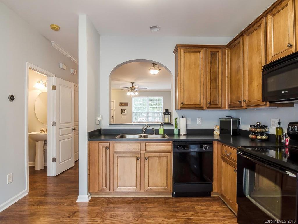 108 Chimney Rock Lane, Unit 16 Fort Mill, SC 29708 - Photo 7 of 21 a kitchen with stainless steel appliances granite countertop a stove a sink and a microwave