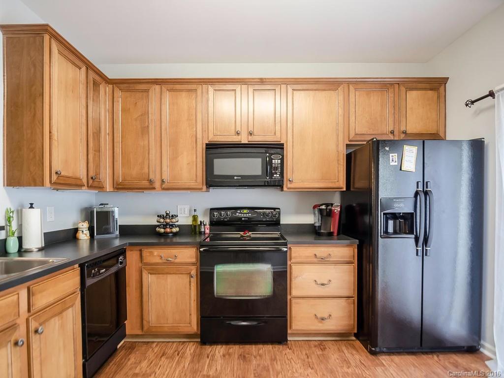 108 Chimney Rock Lane, Unit 16 Fort Mill, SC 29708 - Photo 8 of 21 a kitchen with a stove a sink and a refrigerator