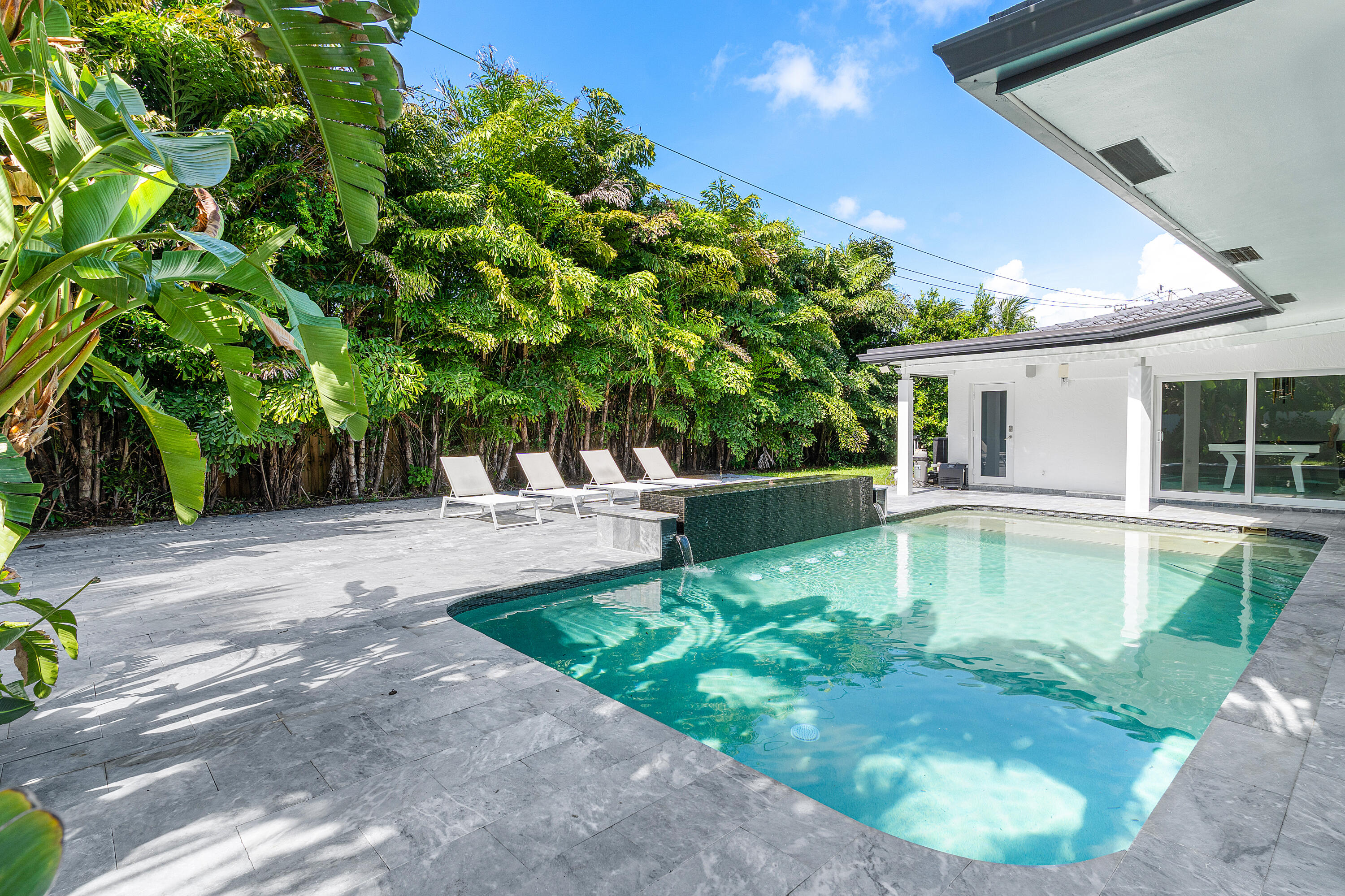 a view of a swimming pool with a patio