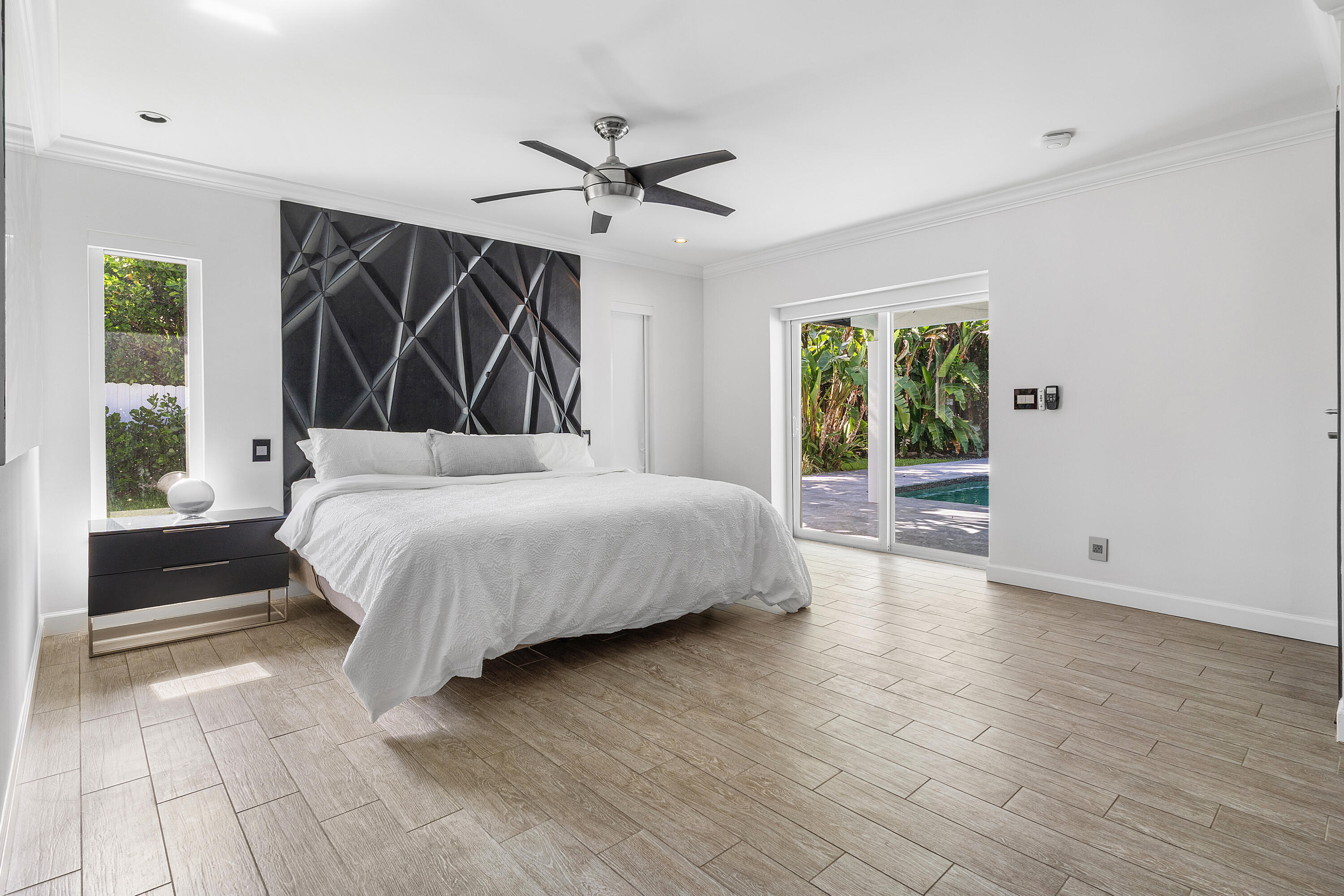960 Southwest 18th Street Boca Raton, FL 33486 - Photo 16 of 40 a bedroom with a large bed closet and window