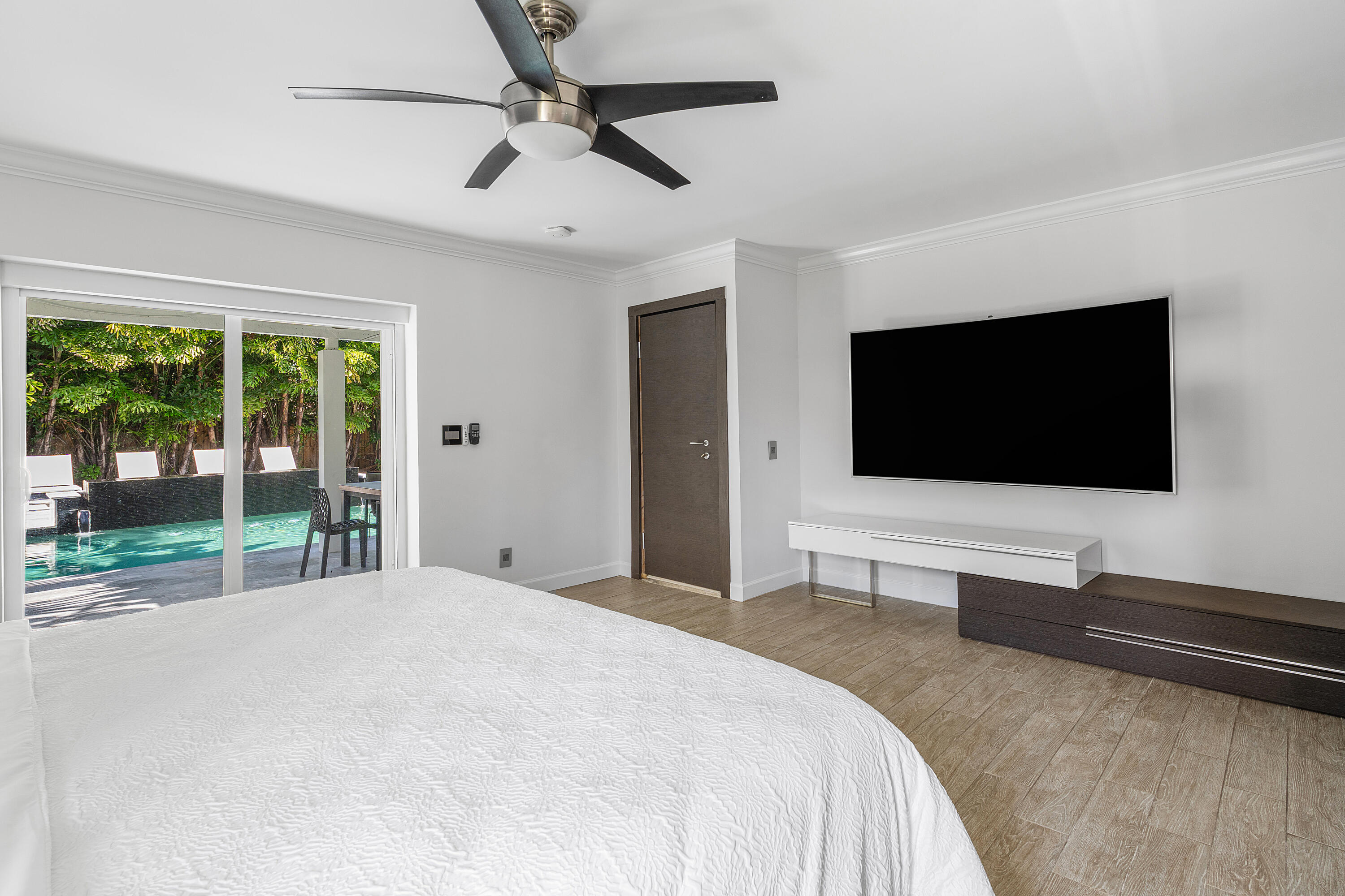 960 Southwest 18th Street Boca Raton, FL 33486 - Photo 17 of 40 a bedroom with a bed and a flat screen tv