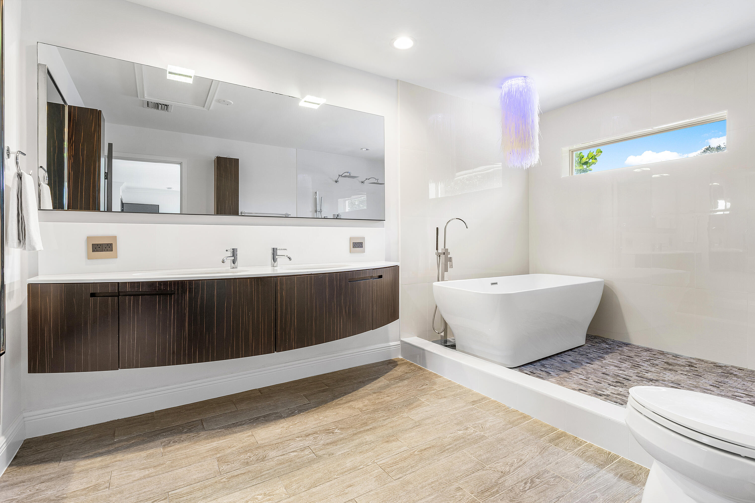 960 Southwest 18th Street Boca Raton, FL 33486 - Photo 18 of 40 a bathroom with a sink and a mirror