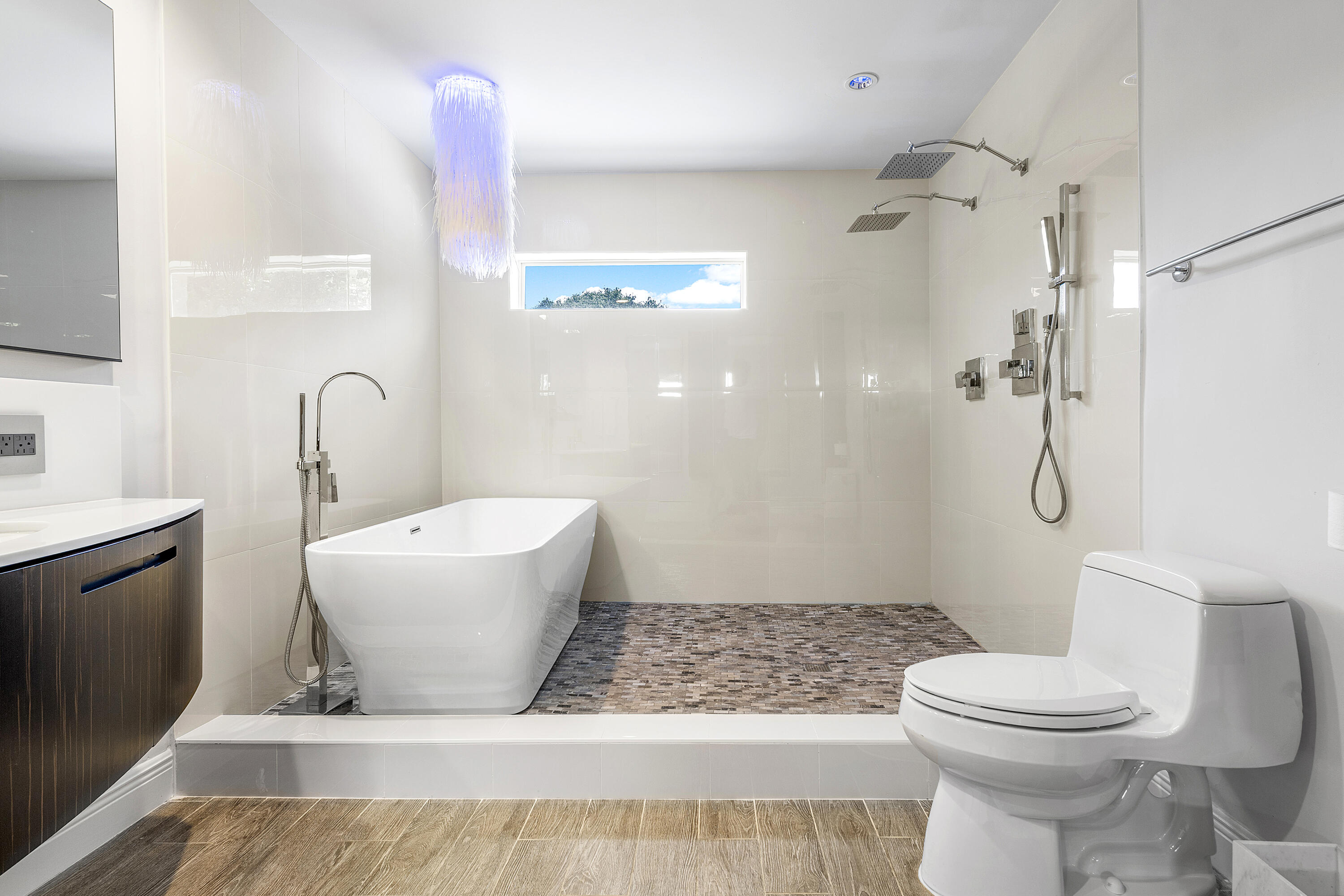 960 Southwest 18th Street Boca Raton, FL 33486 - Photo 19 of 40 a bathroom with a sink toilet and shower
