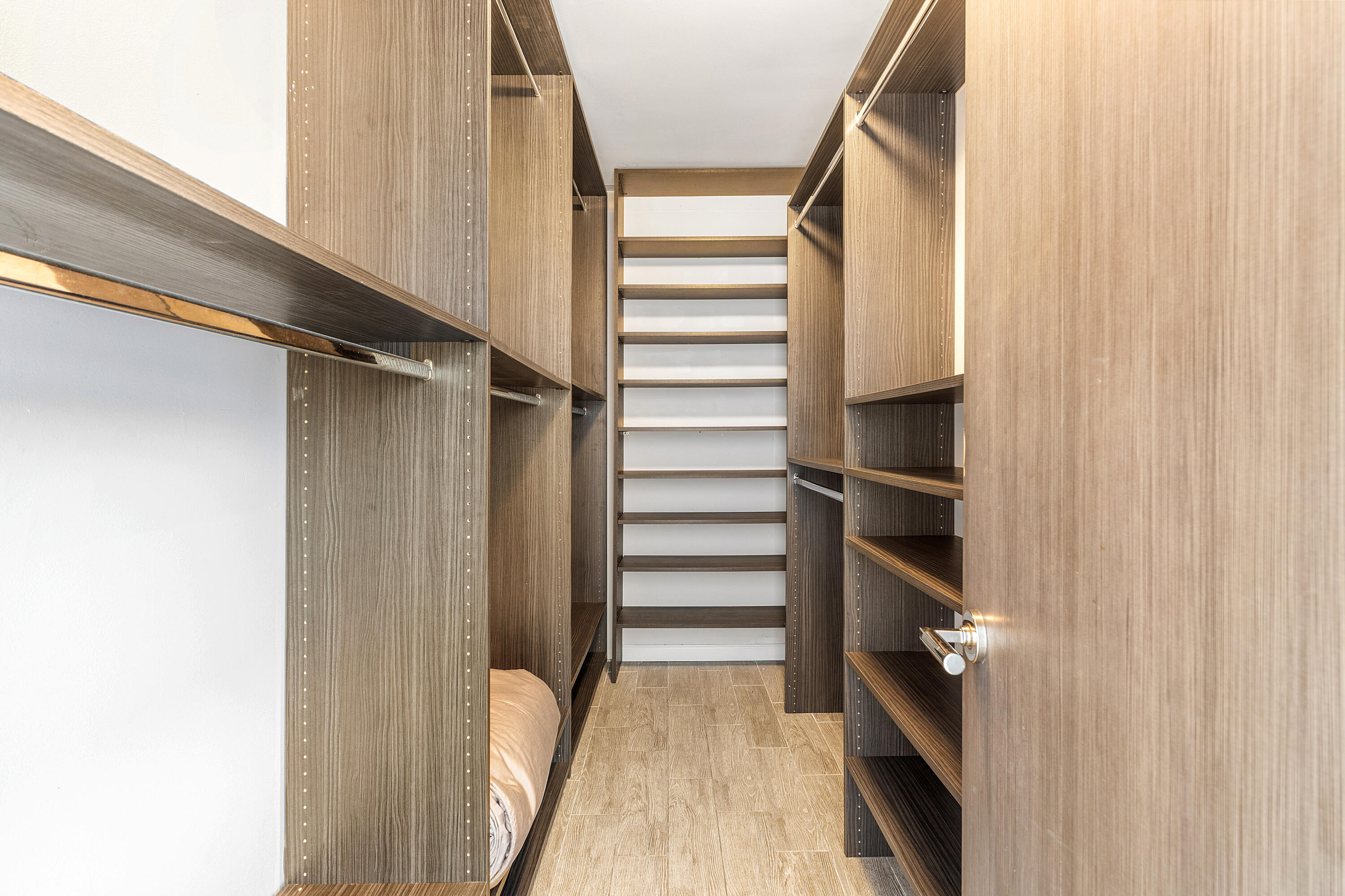 960 Southwest 18th Street Boca Raton, FL 33486 - Photo 21 of 40 a view of walk in closet with empty racks