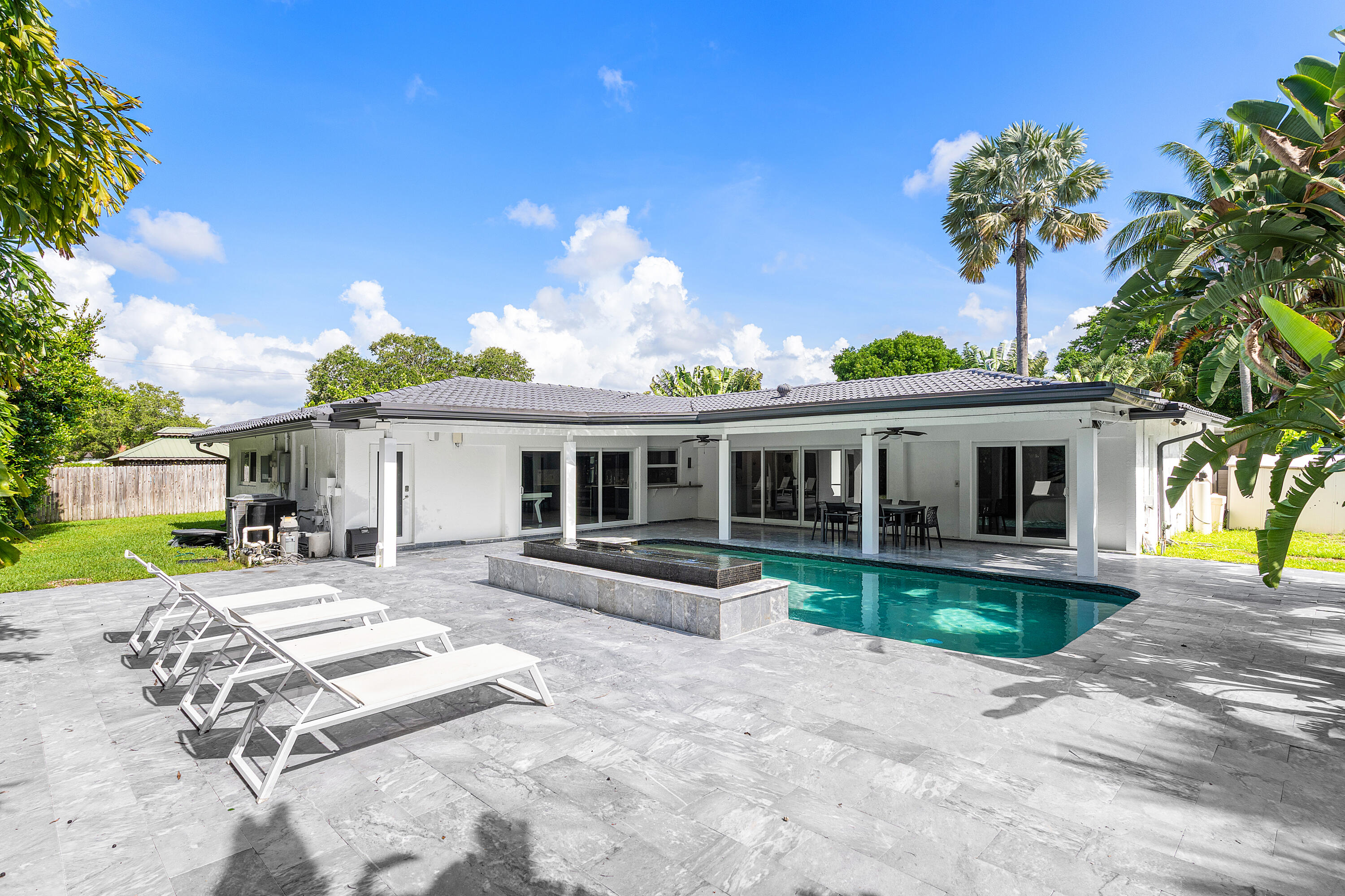 960 Southwest 18th Street Boca Raton, FL 33486 - Photo 22 of 40 a front view of a house with garden