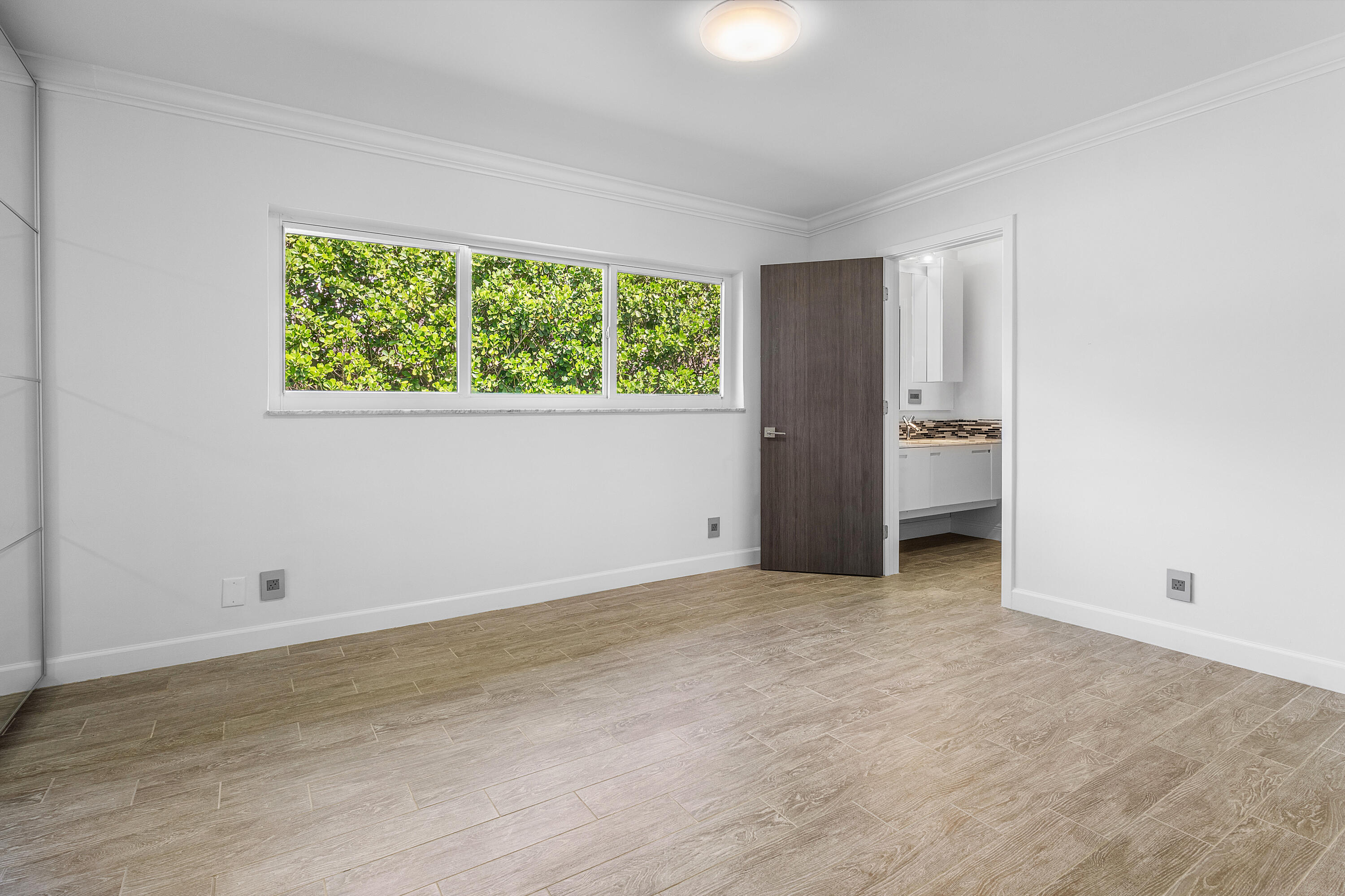 960 Southwest 18th Street Boca Raton, FL 33486 - Photo 27 of 40 an empty room with a window