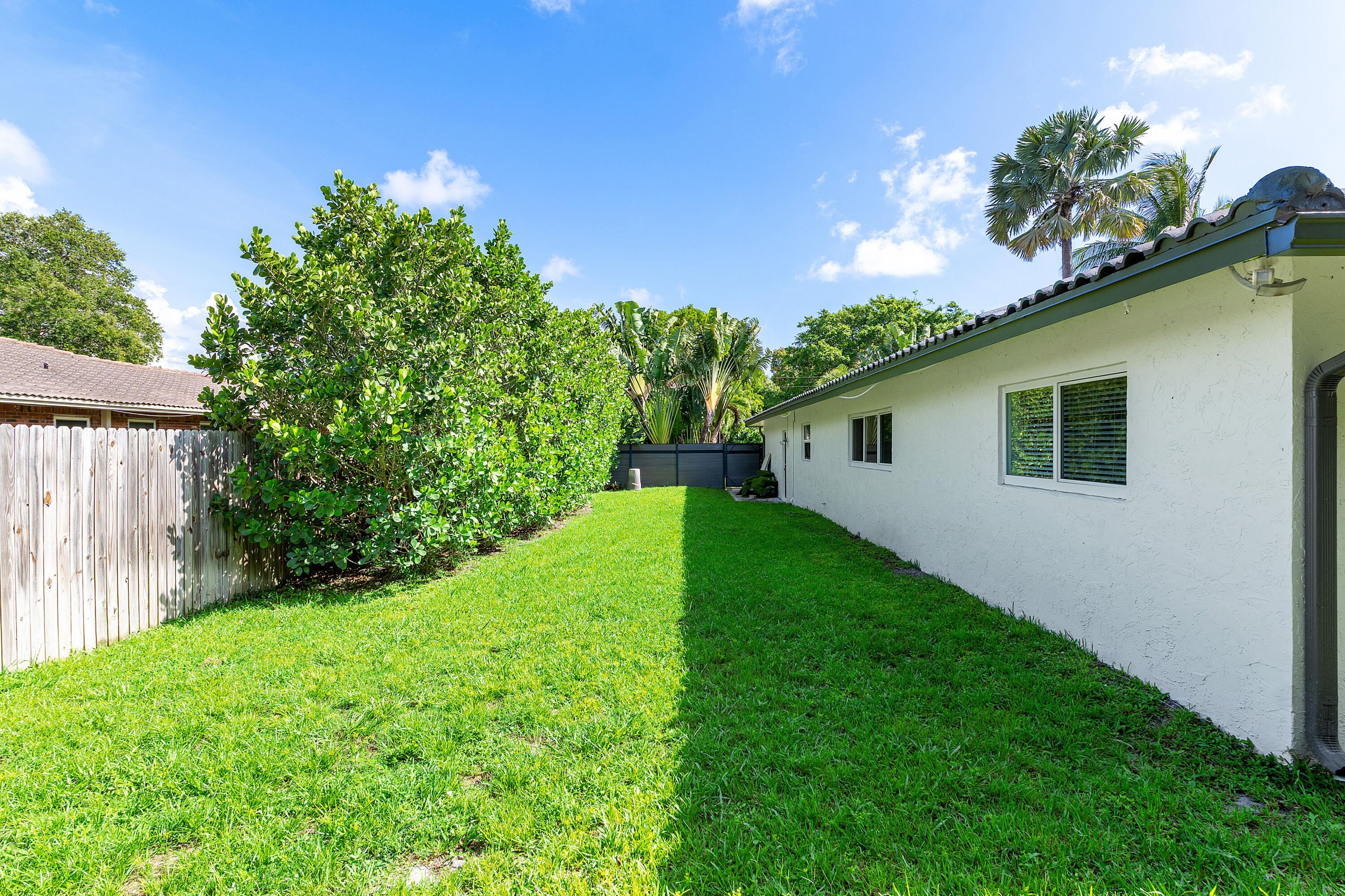 960 Southwest 18th Street Boca Raton, FL 33486 - Photo 34 of 40 a view of a house with a yard