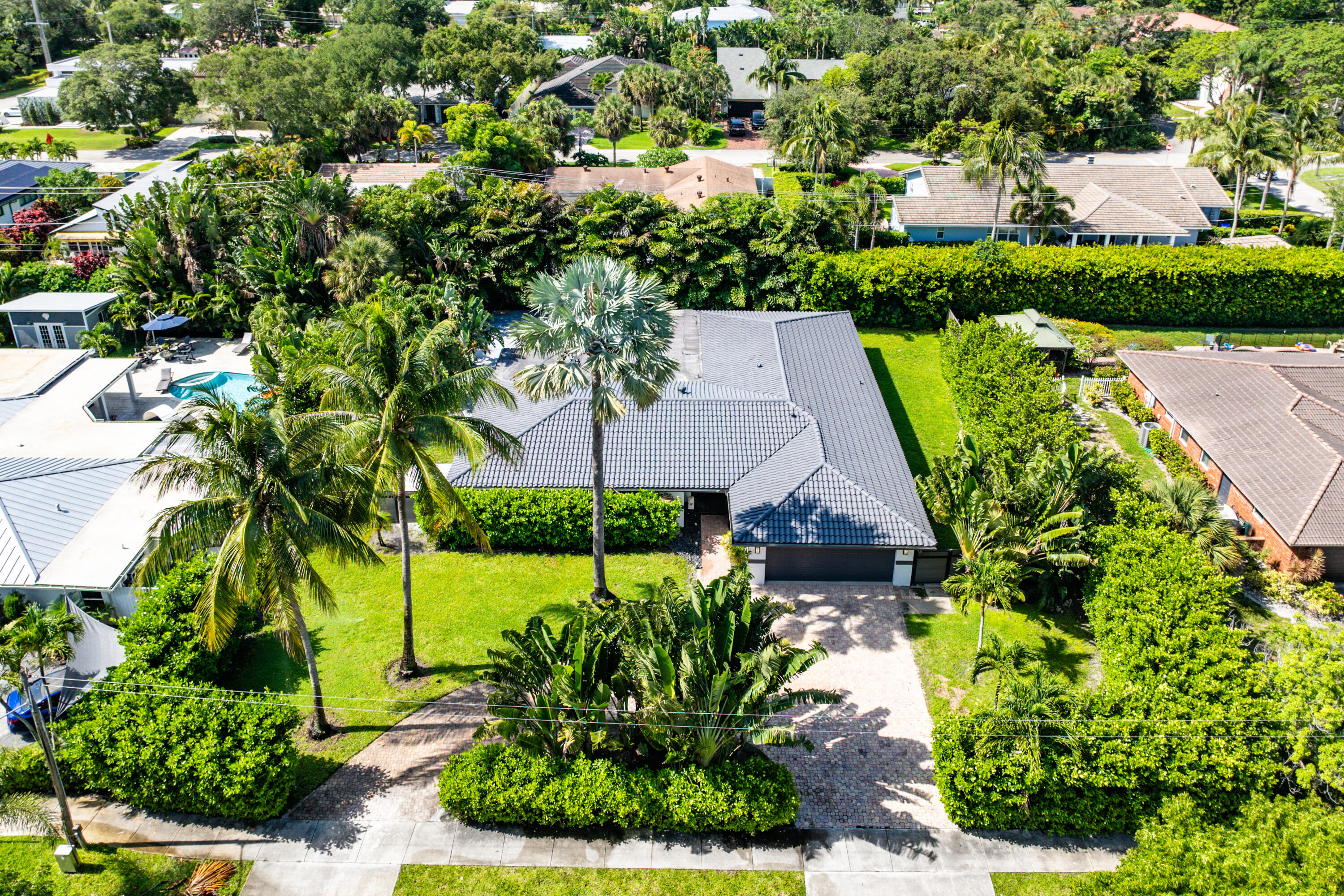 960 Southwest 18th Street Boca Raton, FL 33486 - Photo 35 of 40 an aerial view of a house with a garden and lake view