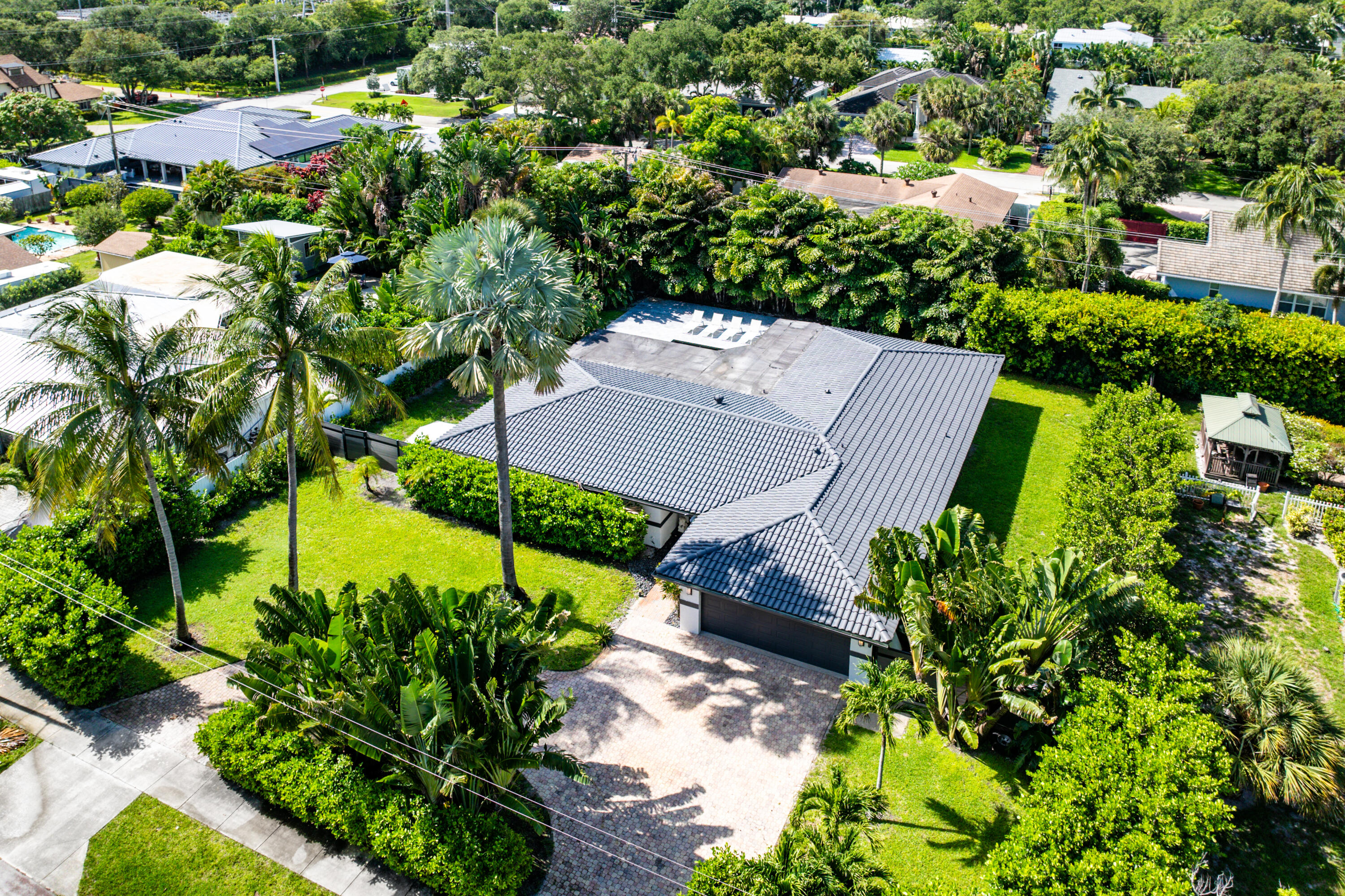 960 Southwest 18th Street Boca Raton, FL 33486 - Photo 37 of 40 an aerial view of a house with a yard and outdoor seating