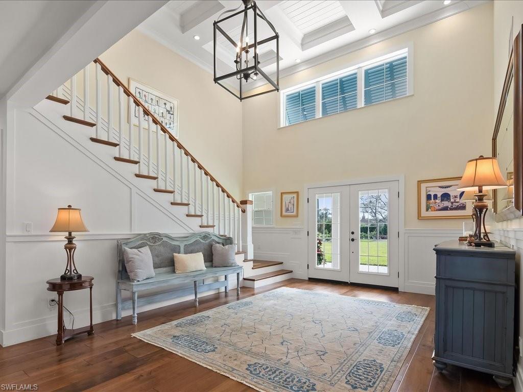 624 Ridge Drive Naples, FL 34108 - Photo 13 of 50 a living room with furniture and a table