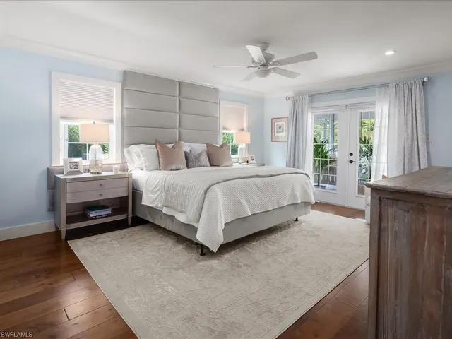 a spacious bathroom with double vanity and a bathtub