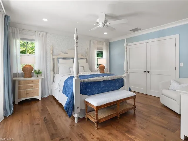 a bed room with a bed and a window