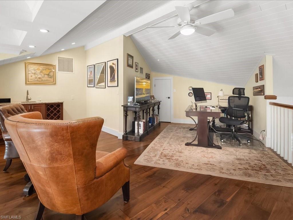 624 Ridge Drive Naples, FL 34108 - Photo 36 of 50 a living room with furniture and a wooden floor