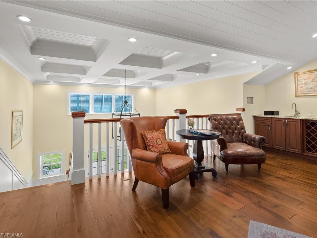 624 Ridge Drive Naples, FL 34108 - Photo 37 of 50 a living room with furniture and wooden floor