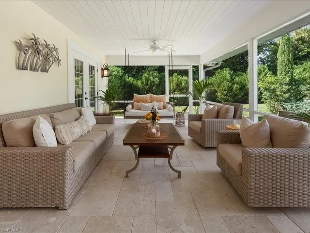 a view of a livingroom with furniture window and wooden floor