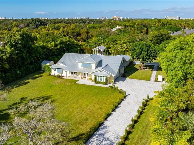 a aerial view of a house with a big yard