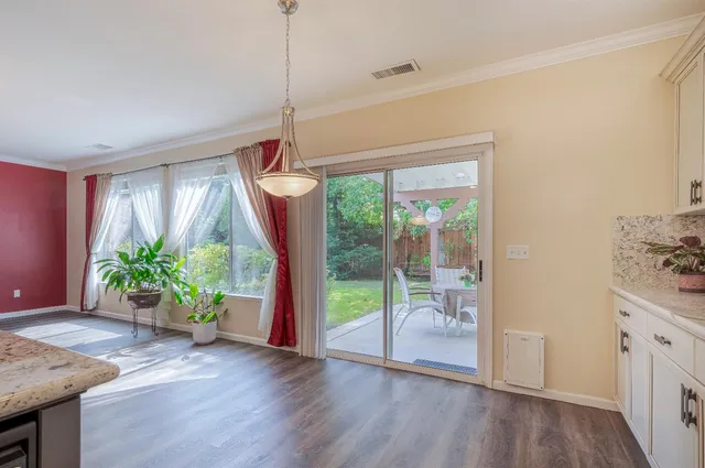 a room that has a bed and a table in it