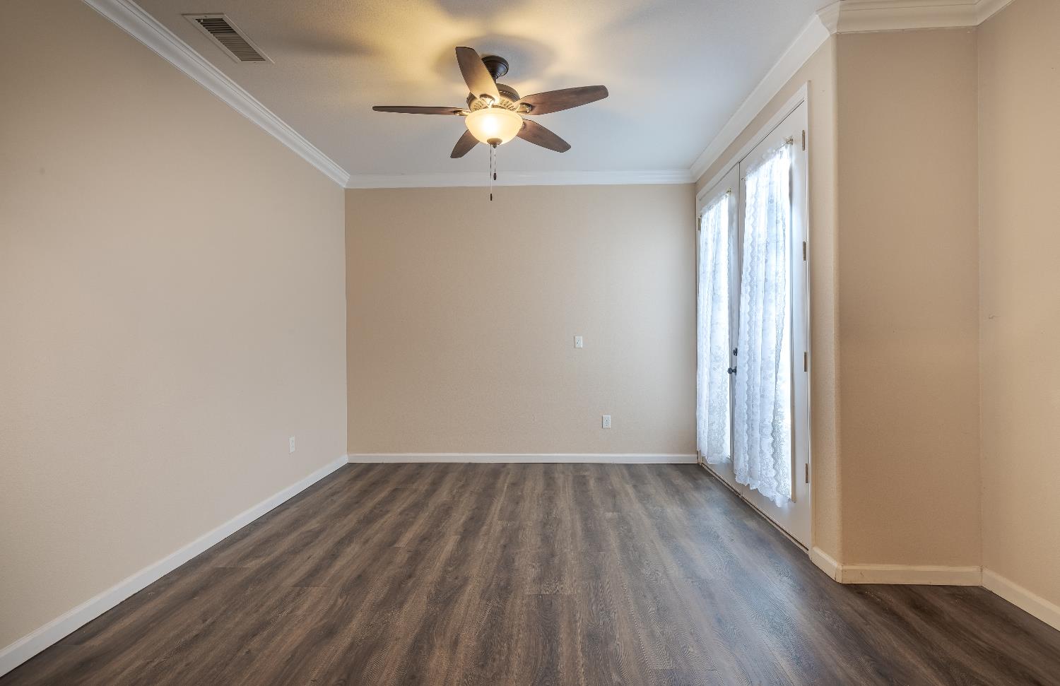 2222 Carson Avenue Clovis, CA 93611 - Photo 17 of 41 wooden floor in an empty room with a window