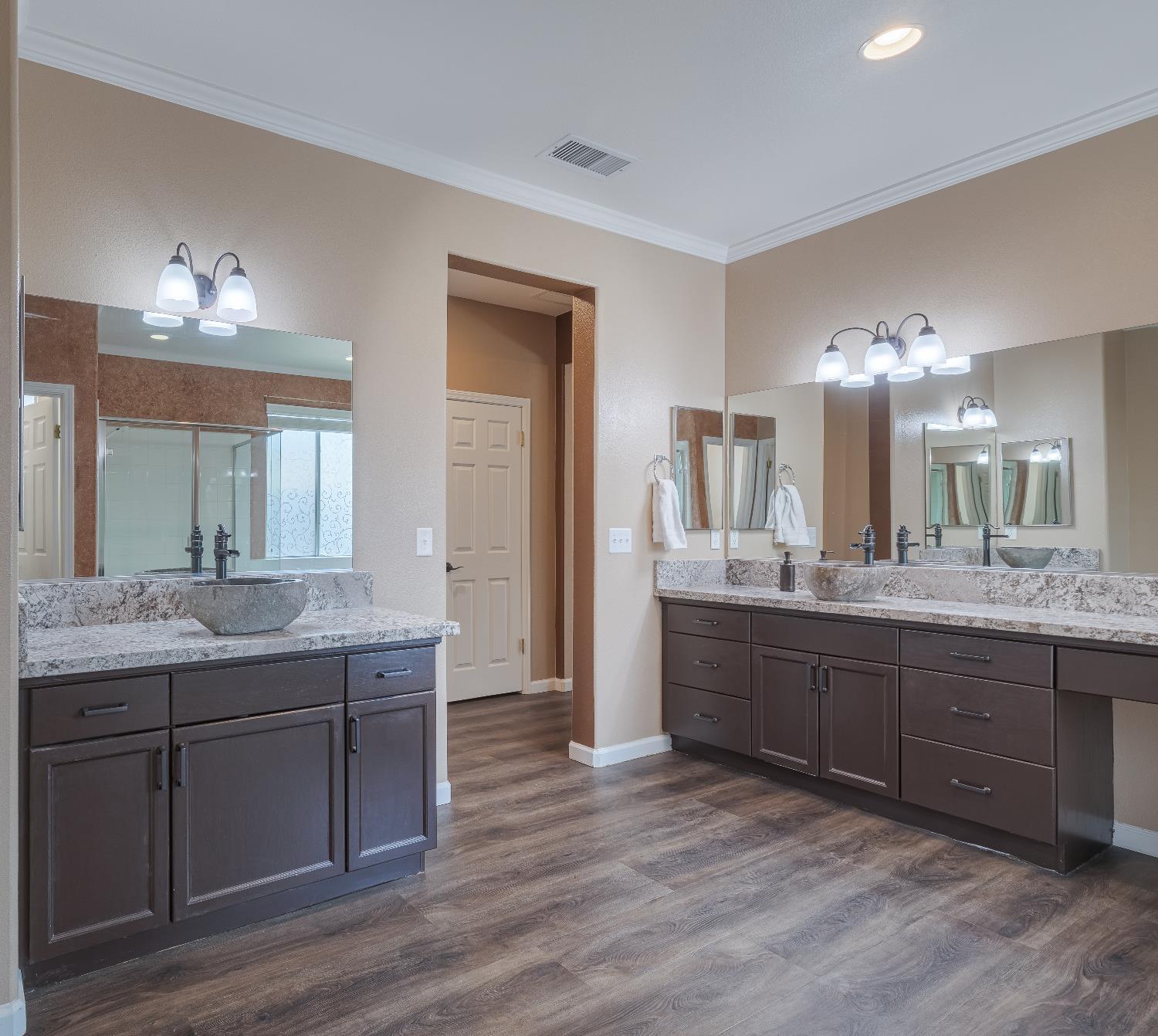 2222 Carson Avenue Clovis, CA 93611 - Photo 26 of 41 a bathroom with a granite countertop sink and a mirror