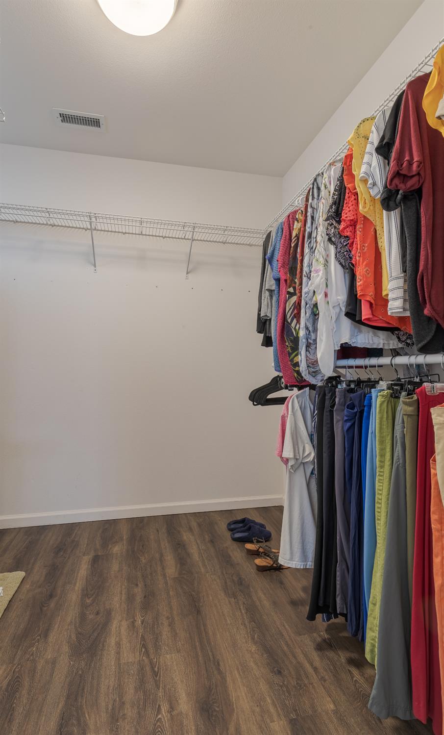 2222 Carson Avenue Clovis, CA 93611 - Photo 28 of 41 a view of walk in closet with clothes
