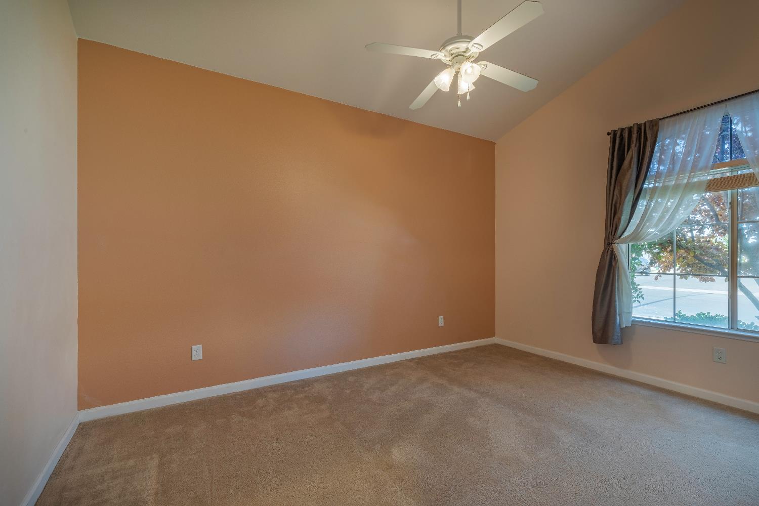 2222 Carson Avenue Clovis, CA 93611 - Photo 31 of 41 an empty room with windows and fan