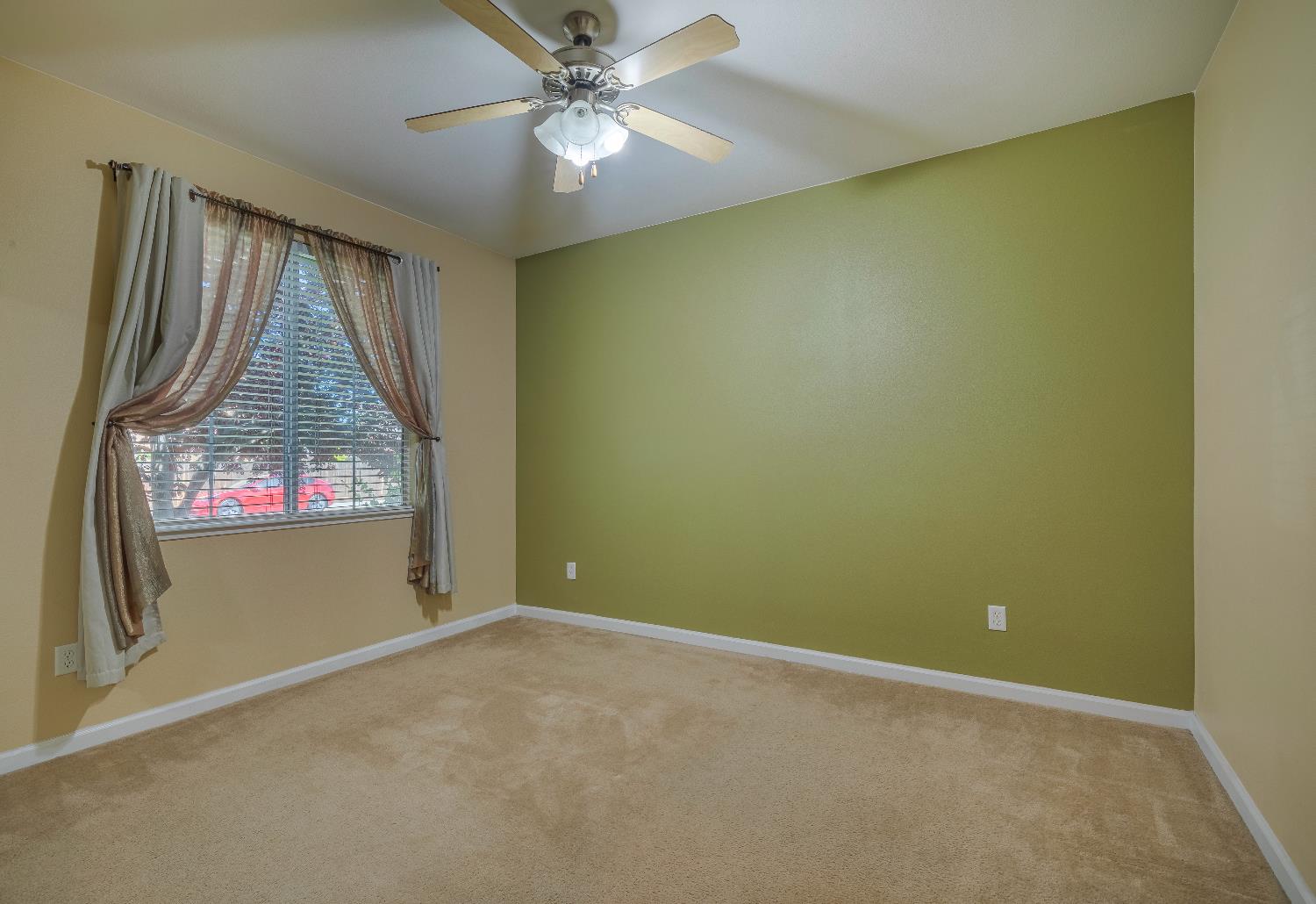 2222 Carson Avenue Clovis, CA 93611 - Photo 32 of 41 an empty room with windows and fan