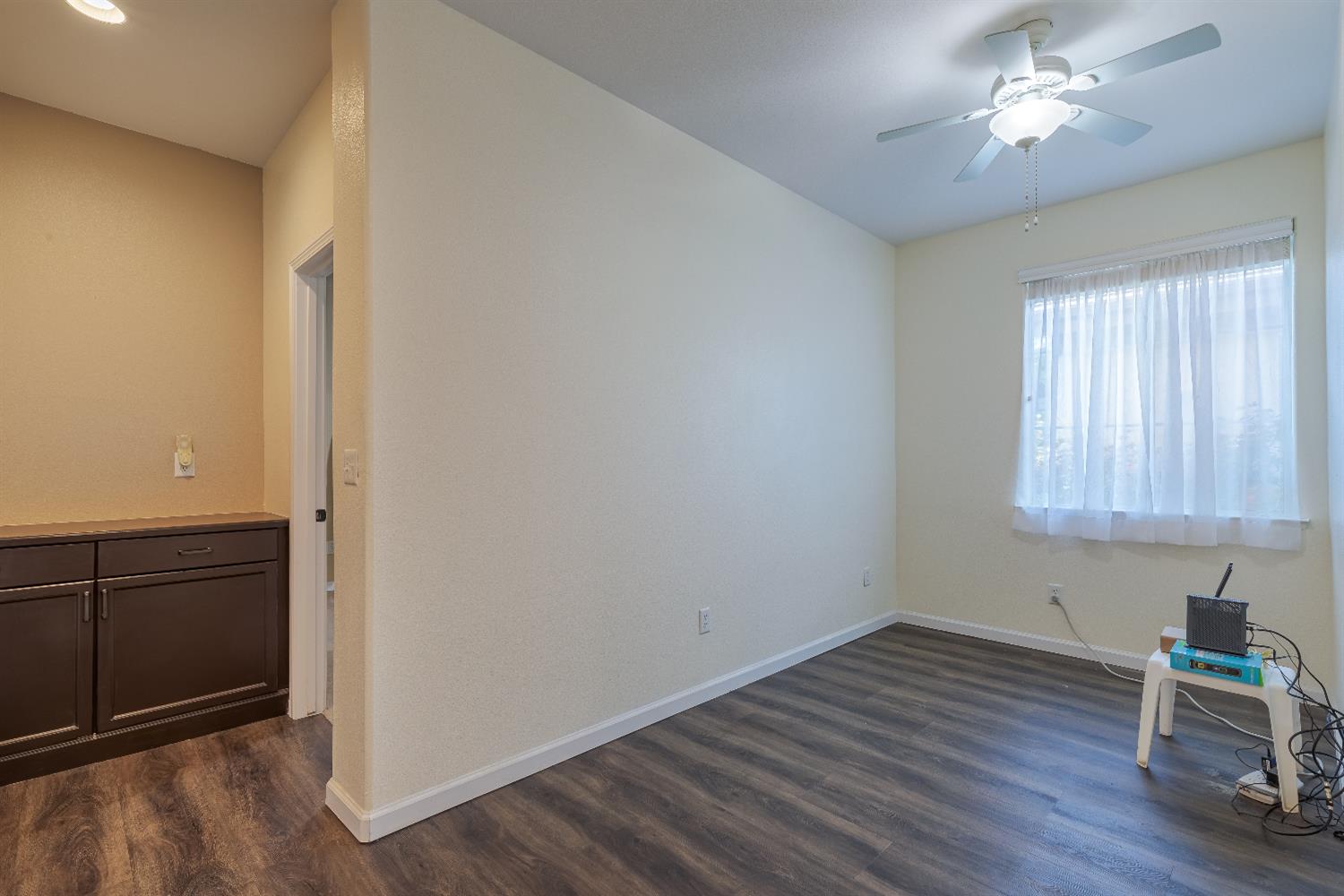 2222 Carson Avenue Clovis, CA 93611 - Photo 33 of 41 wooden floor in an empty room with a window