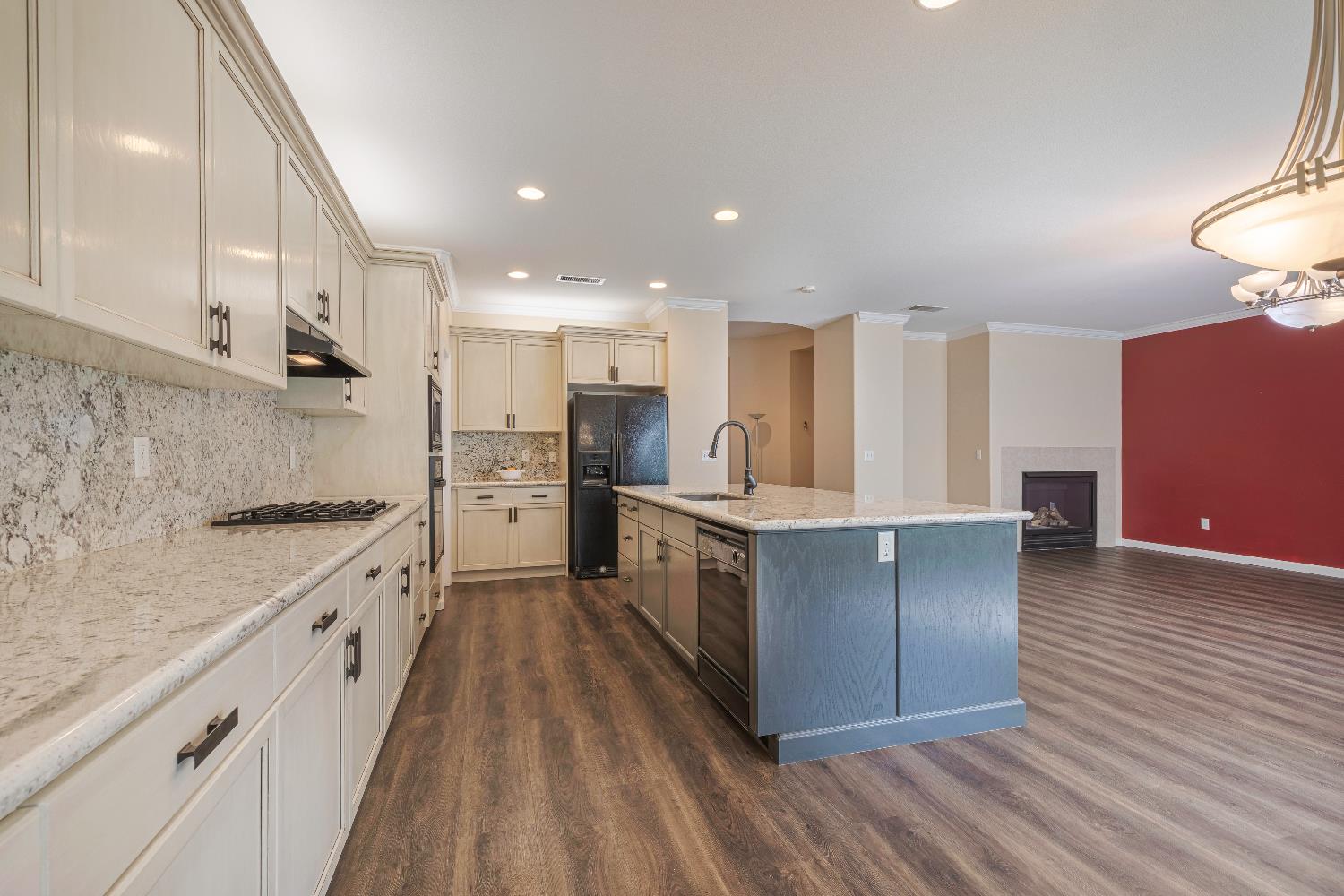 2222 Carson Avenue Clovis, CA 93611 - Photo 8 of 41 a large kitchen with stainless steel appliances sink a microwave and cabinets