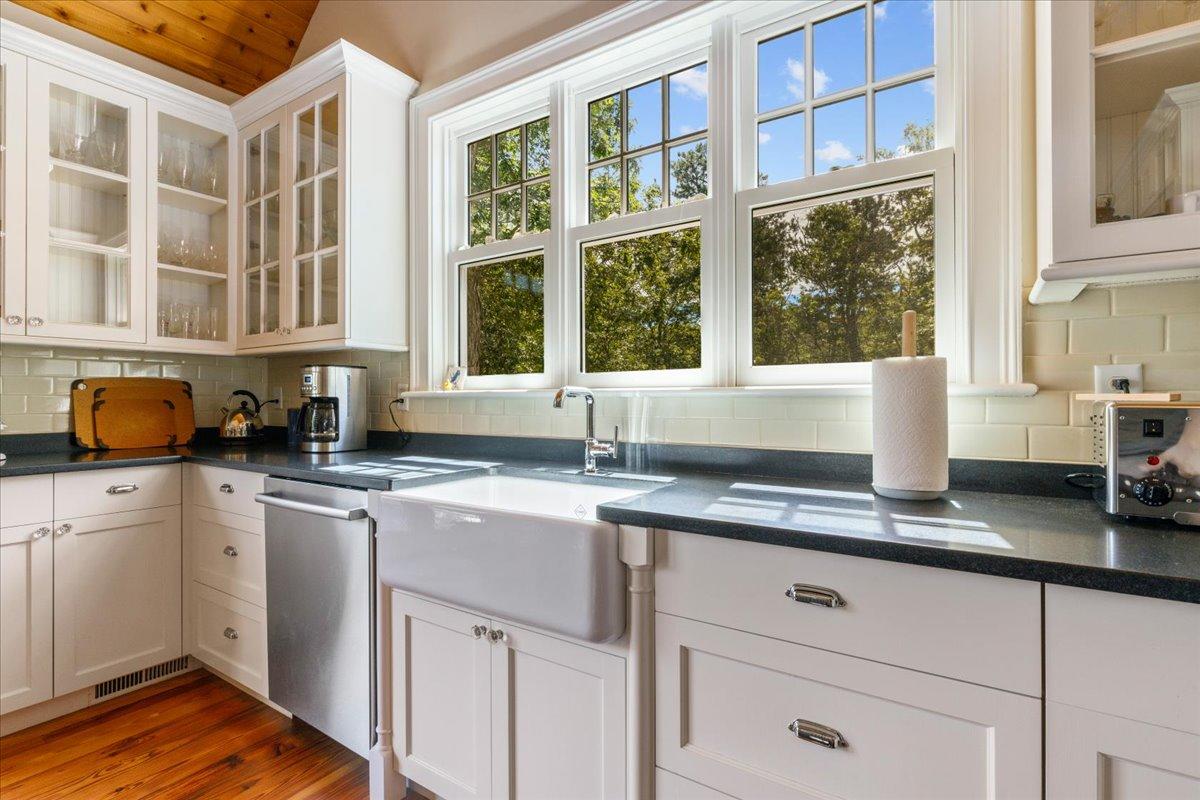58 Slough Pond Road Truro, MA 02666 - Photo 11 of 82 a kitchen with stainless steel appliances granite countertop a sink and cabinets