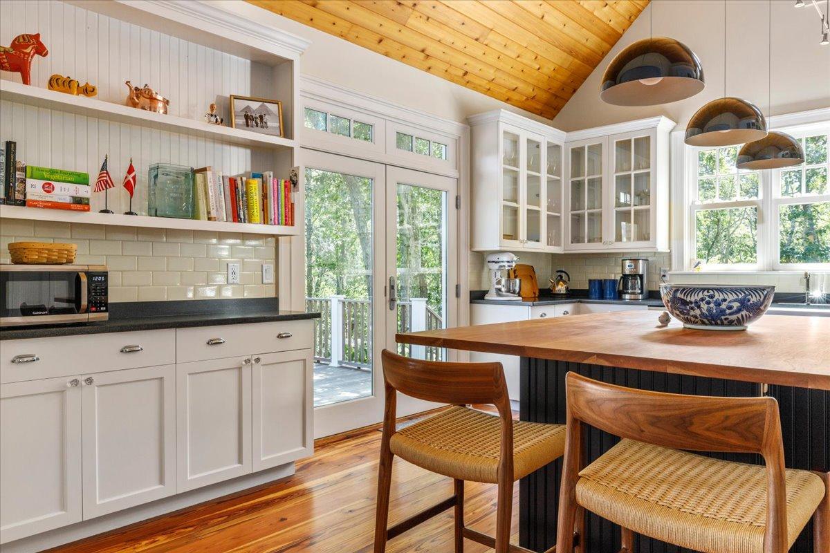 58 Slough Pond Road Truro, MA 02666 - Photo 13 of 82 a kitchen with stainless steel appliances granite countertop a stove a sink and a cabinets