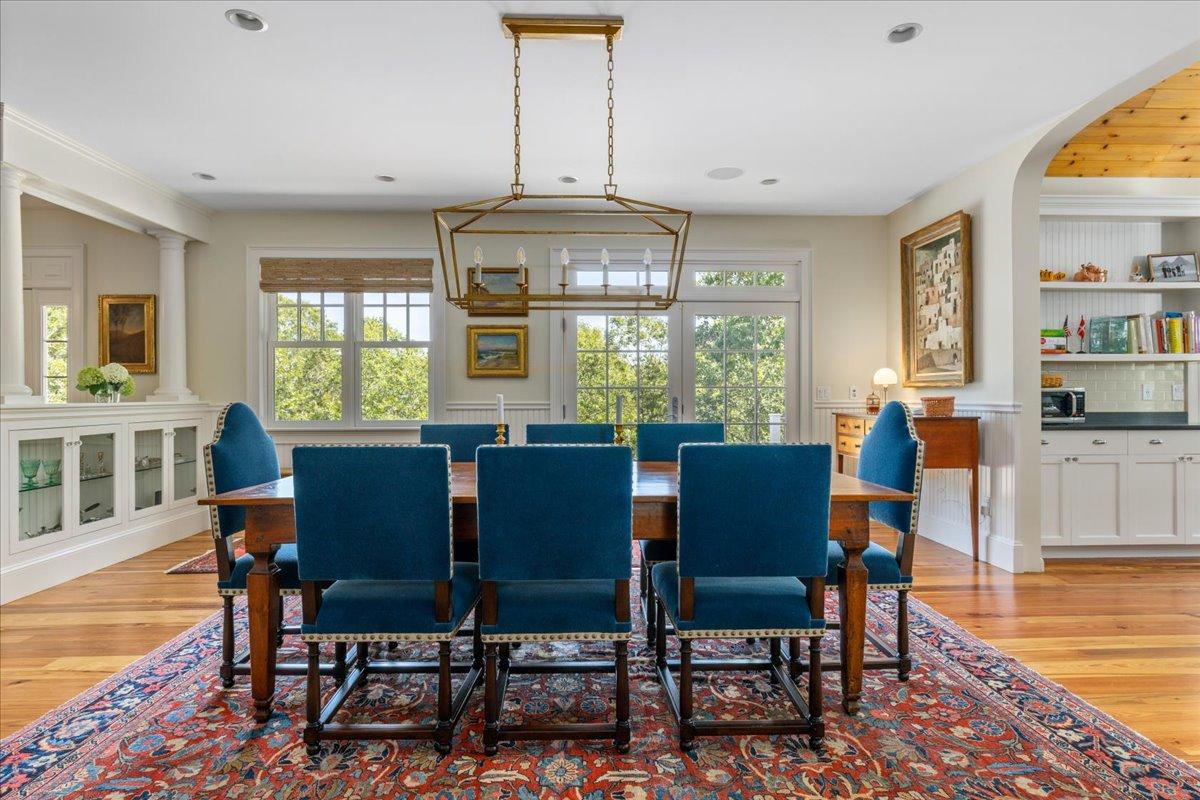 58 Slough Pond Road Truro, MA 02666 - Photo 15 of 82 a dining room with furniture a chandelier and wooden floor