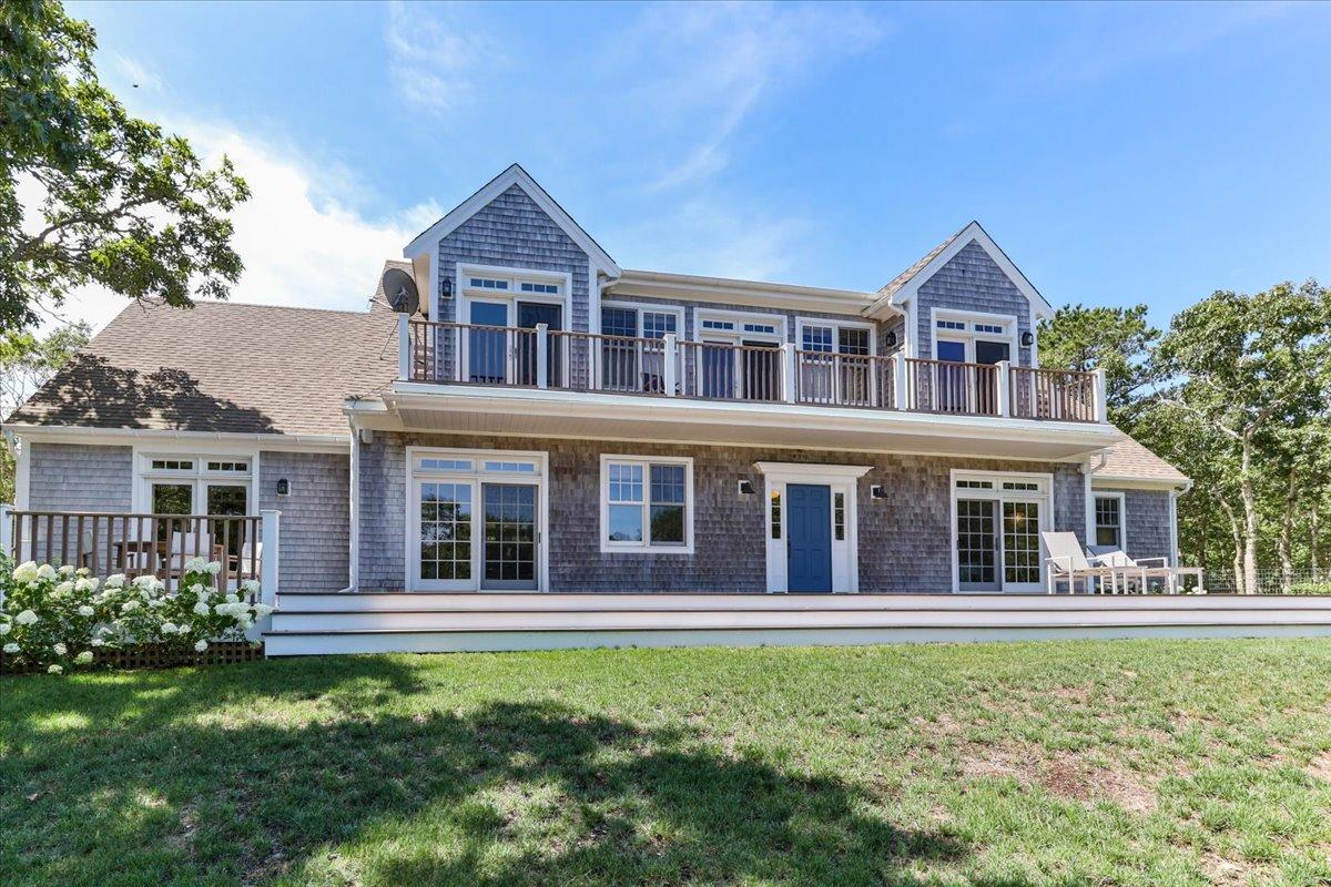 58 Slough Pond Road Truro, MA 02666 - Photo 2 of 82 a front view of a house with a garden