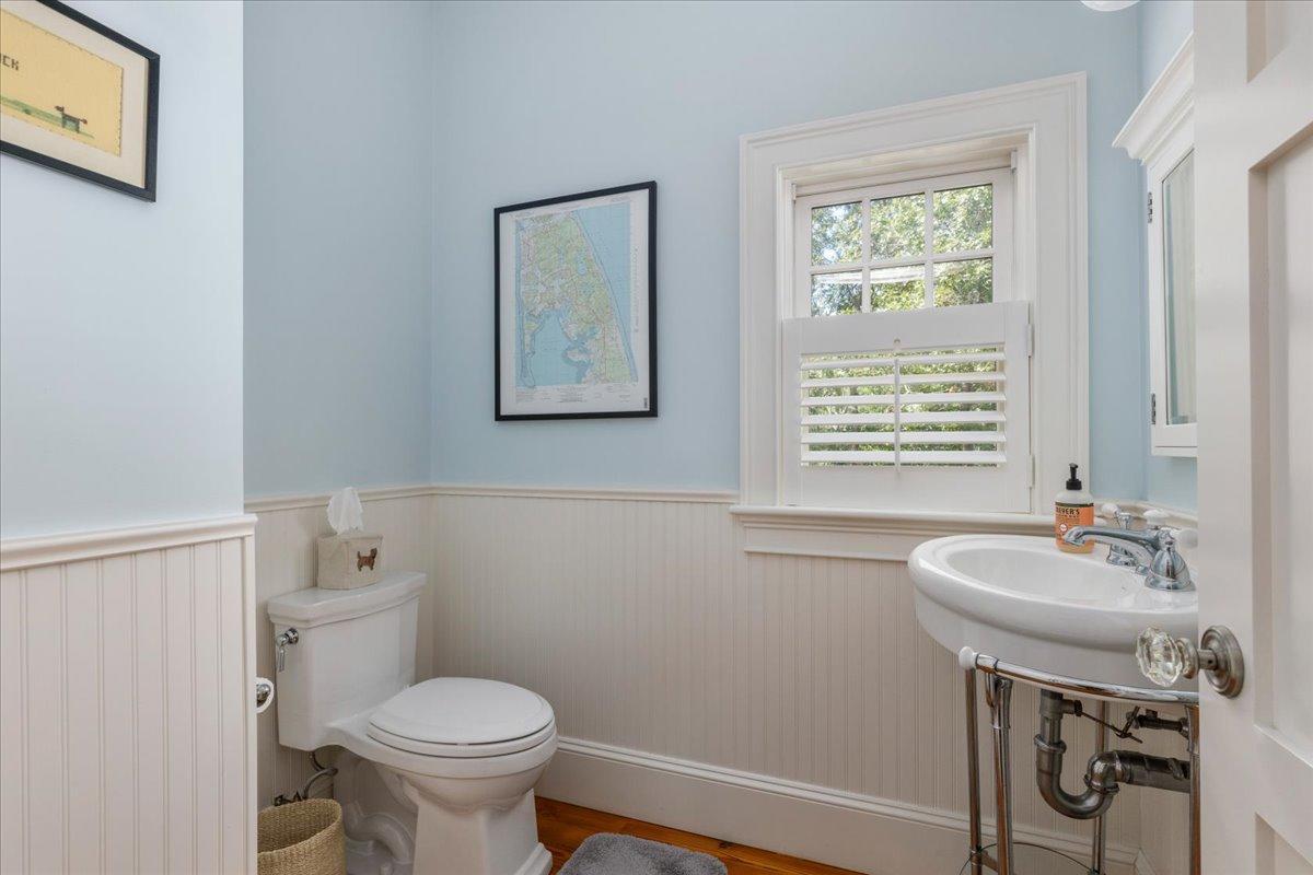 58 Slough Pond Road Truro, MA 02666 - Photo 22 of 82 a bathroom with a sink a toilet and a mirror