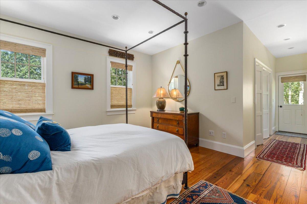 58 Slough Pond Road Truro, MA 02666 - Photo 23 of 82 a bedroom with a bed and wooden floor