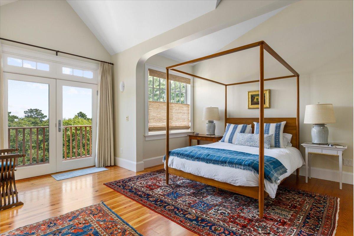 58 Slough Pond Road Truro, MA 02666 - Photo 29 of 82 a bedroom with a large bed and a large window