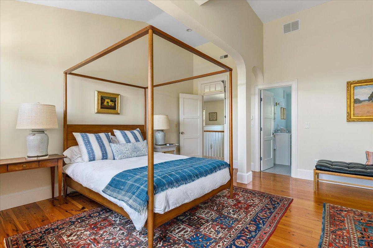 58 Slough Pond Road Truro, MA 02666 - Photo 30 of 82 a bedroom with a bed and a lamp on table