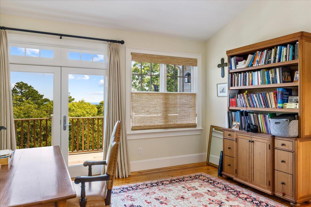 58 Slough Pond Road Truro, MA 02666 - Photo 37 of 82 a view of a workspace with furniture and a book shelf
